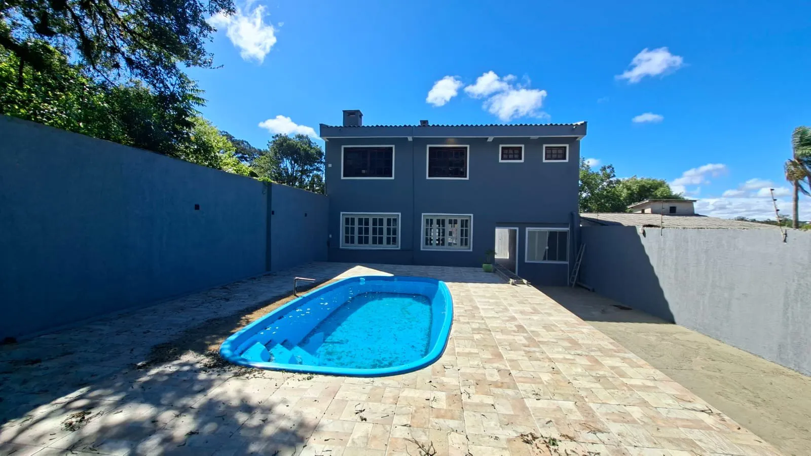 Imagem Casa impecável com suíte, piscina e espaço gourmet no Dom Feliciano - Centro de Viamão!