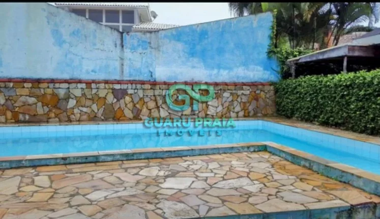 Imagem Casa com 6 quartos sendo 4 suítes, sala de jantar, sala de estar, sala de TV, 5 banheiros, cozinha armário planejado, lavanderia, churrasqueira, piscina, lindo jardim arborizado