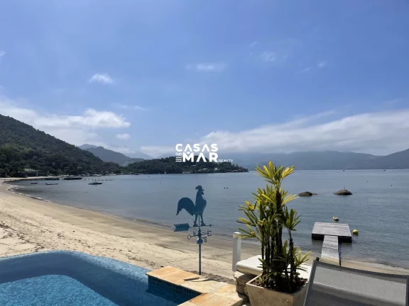 Imagem Casa de Luxo à Beira-Mar em Condomínio na Vila Velha, Angra dos Reis-RJ: 6 Quartos, 6 Suítes, 7 Salas e 7 Banheiros.