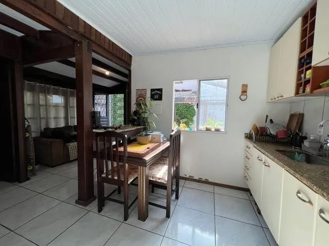Imagem Terreno medindo 11 X 39,66 com 2 casas de alvenaria