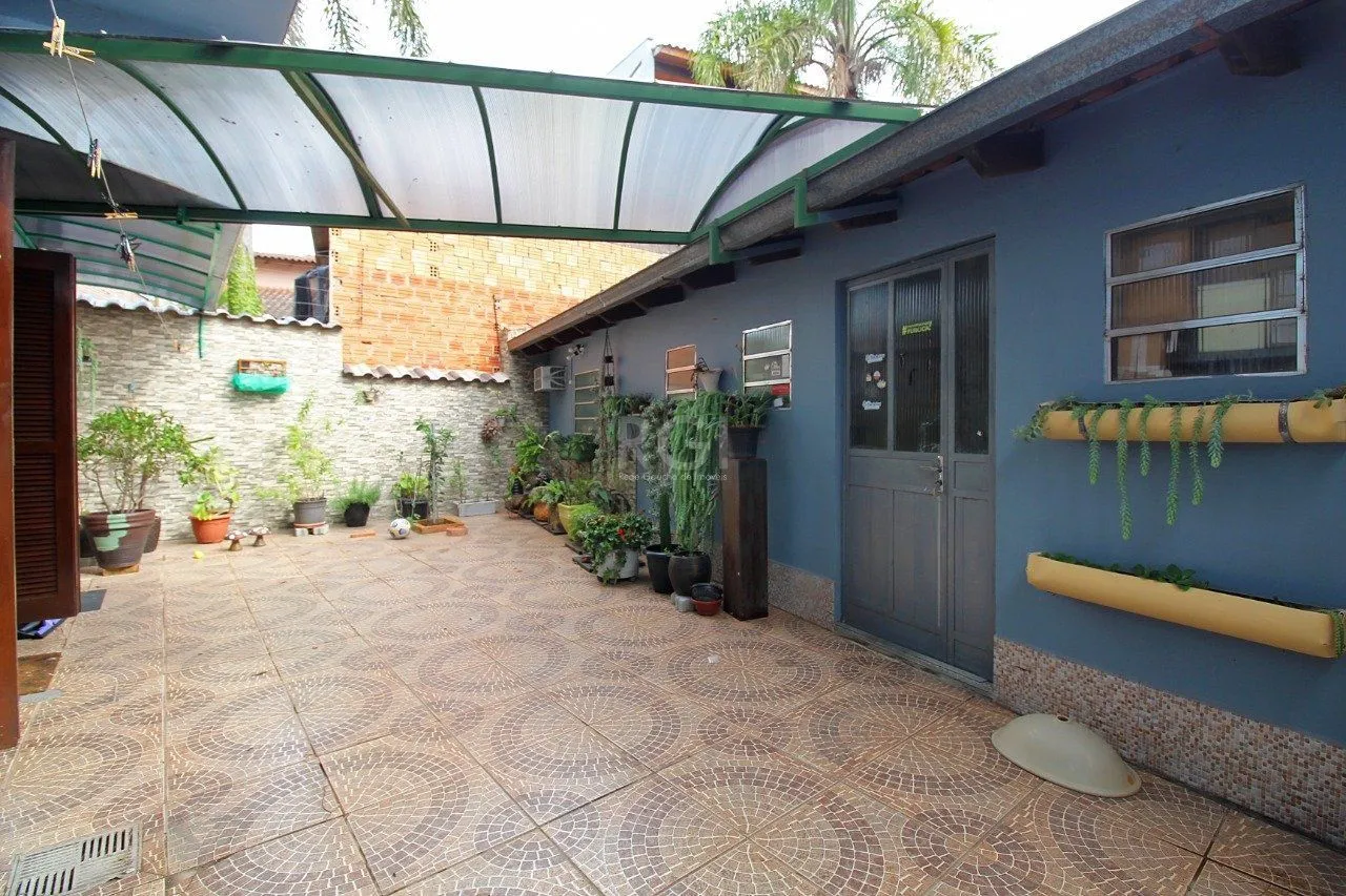 Imagem Casa para Venda - 339m², 3 dormitórios, 2 vagas - Vila Nova, Porto Alegre