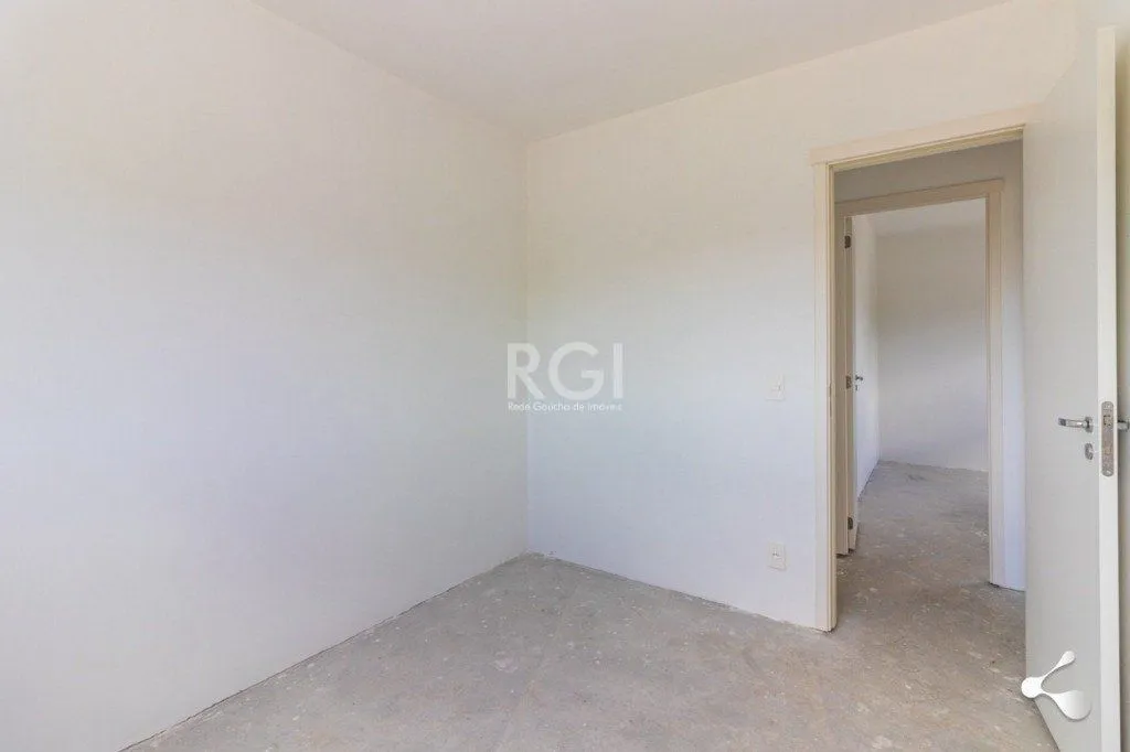 Imagem Vende apartamento, 03 dormitórios, living para dois ambientes, banheiro social, cozinha com churrasqueira e área de serviço e garagem.