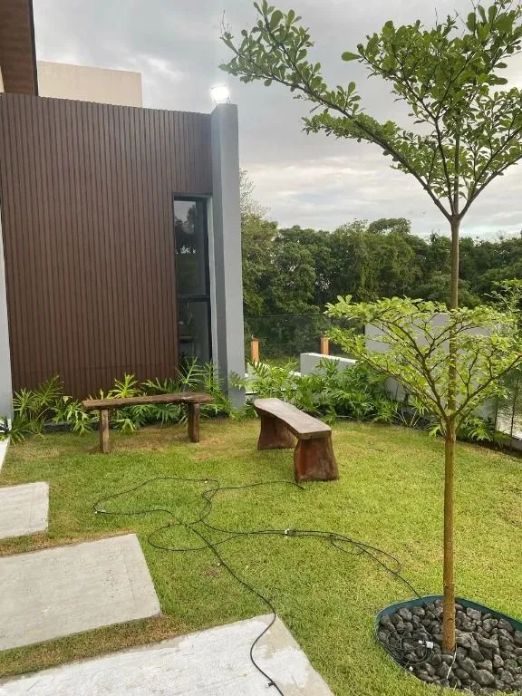 Imagem Casa de luxo no Alphaville Paraíba com 5 suítes, área gourmet integrada, escritório, jardins e lazer completo.