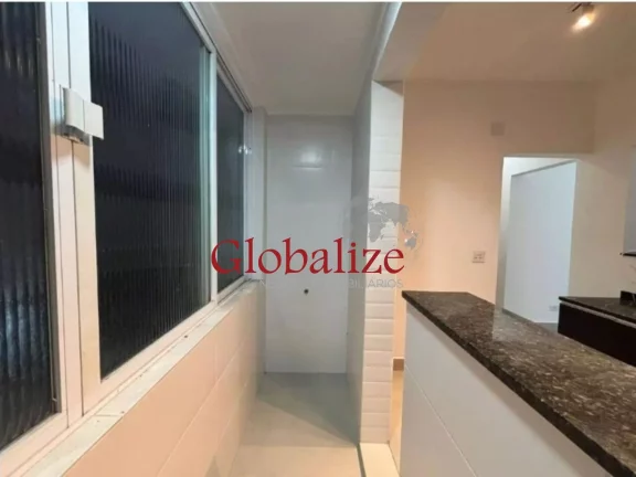 Imagem Apartamento à venda com 70m², 2 quartos, cozinha americana, 1 vaga por R$430.000 no Gonzaga em Santos