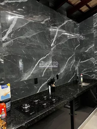 Imagem Casa à venda no Jardim Espanha, Uberaba | 2 dormitórios, suíte, piscina e varanda gourmet