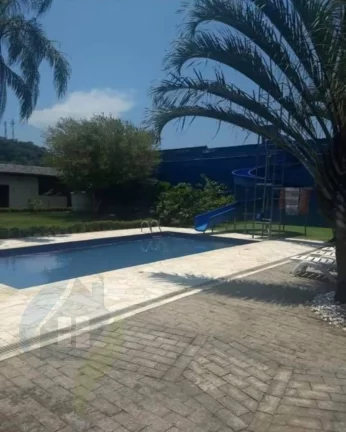 Imagem Casa de 7 dormitórios, 4 suíte, 6 banheiros e 2 vagas, com 327,695m² construída e 1.047,75m² total em Centervalle, Bertioga