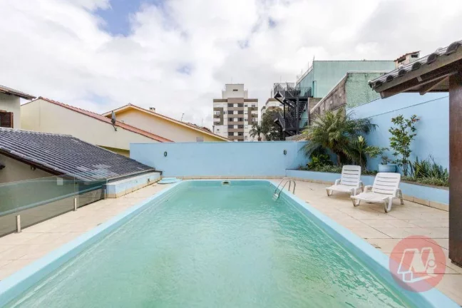 Imagem Casa de 208 m² com 4 quartos, 3 vagas e piscina.
