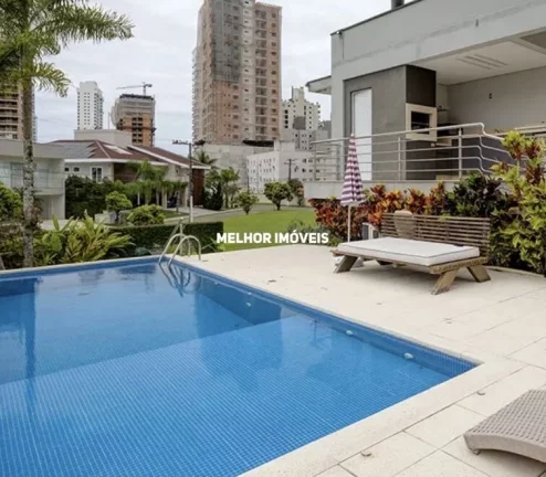 Imagem Casa em condomínio fechado á venda com 4 suítes, 2 vagas localizado na Praia Brava.