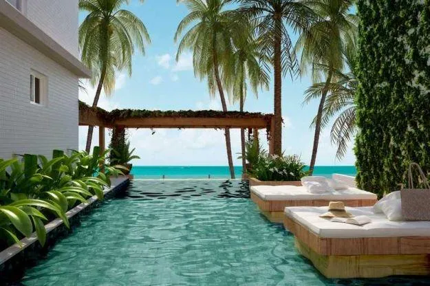 Imagem Flat pé na areia no Bessa com varanda gourmet, mobiliado, lazer completo e excelente potencial para moradia ou investimento.