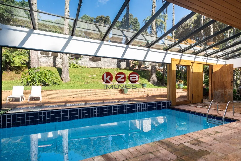 Imagem Imóvel de luxo à venda em Campos do Jordão-SP: Casa com 6 quartos, 4 suítes, 3 salas e 8 banheiros no bairro Toriba