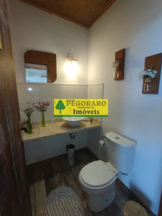 Imagem Casa à venda em Caraguatatuba-SP: 3 quartos, suíte, sala com vista para o mar e deck com hidro!