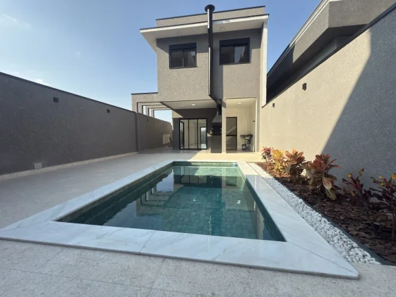 Imagem Casa a venda com 3 suítes, 4 vagas e piscina deslumbrante.