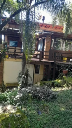 Imagem Casa Rústica em Garopaba-SC: 3 Suítes, Vista Panorâmica, Jacuzzi e 3000m² de Terreno