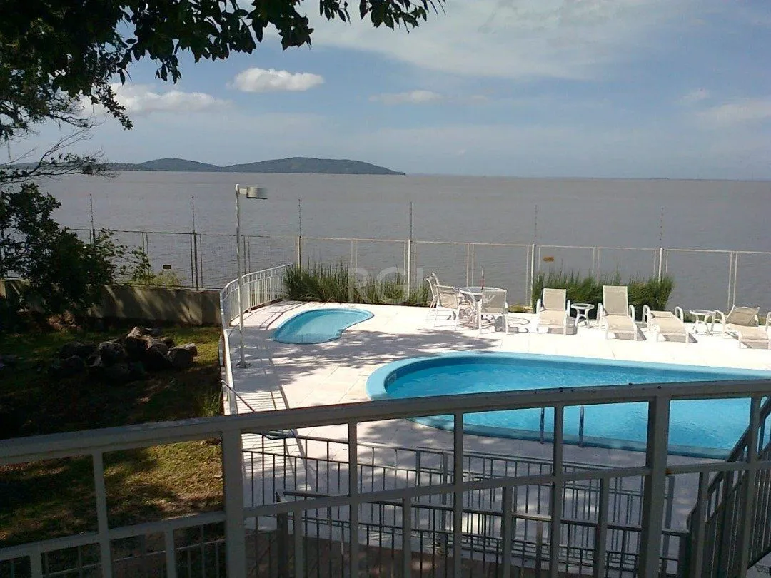 Imagem casa em condomínio fechado, às margens do rio guaíba,