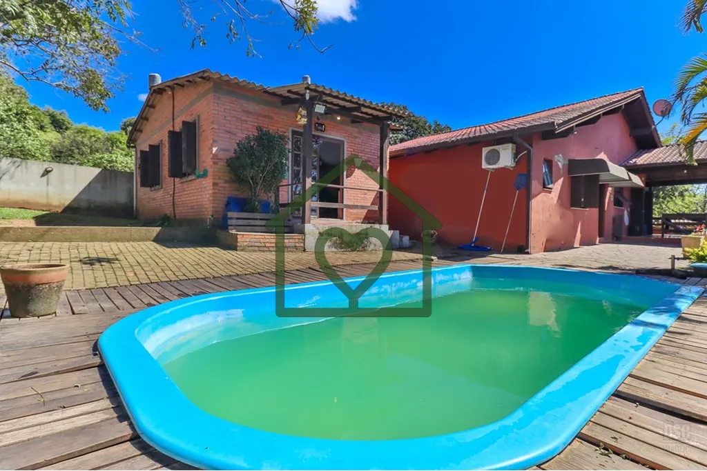 Imagem Casa à venda no bairro Hípica com 165 m2 de área privativa em terreno de 492 m2. O imóvel conta ...