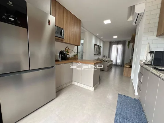 Imagem Imóvel à Venda na Riviera de São Lourenço, Com 2 dormitórios 1 suíte, com 62m² de área útil, 2 vagas de garagem