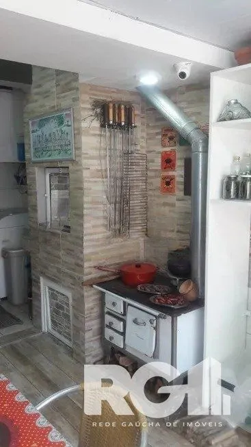 Imagem Casa residencial com 3 dormitórios 90m² privativos, e 2 vagas à venda no bairro Parque Santa Fé em Porto Alegre