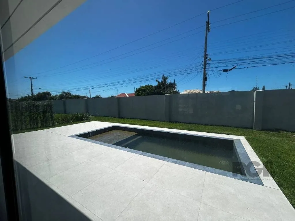 Imagem Casa de Condomínio em Atlântida Sul