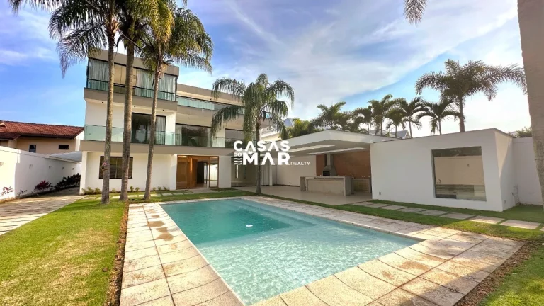 Imagem Imponente residência de luxo com 4 suítes na Barra da Tijúca, Rio de Janeiro - RJ: 3 salas, 6 vagas e 1.000m² de puro requinte!