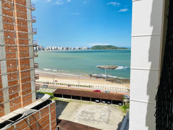 Imagem Apartamento a venda na praia do morro frente para o mar, 3 quartos sendo uma suite, todos eles em porcelanato. com 02 vagas de garagem.