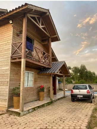 Imagem Casa à venda em Imbituba-SC, Alto Arroio: 4 quartos, 1 suíte, piscina e 150m² - Imperdível!
