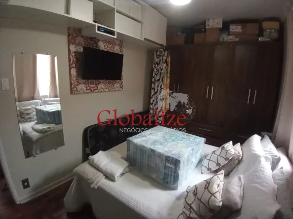 Imagem Casa em Vila à venda com 2 quartos, 2 banheiros, churrasqueira na Vila Mathias em Santos por R$426.000,00