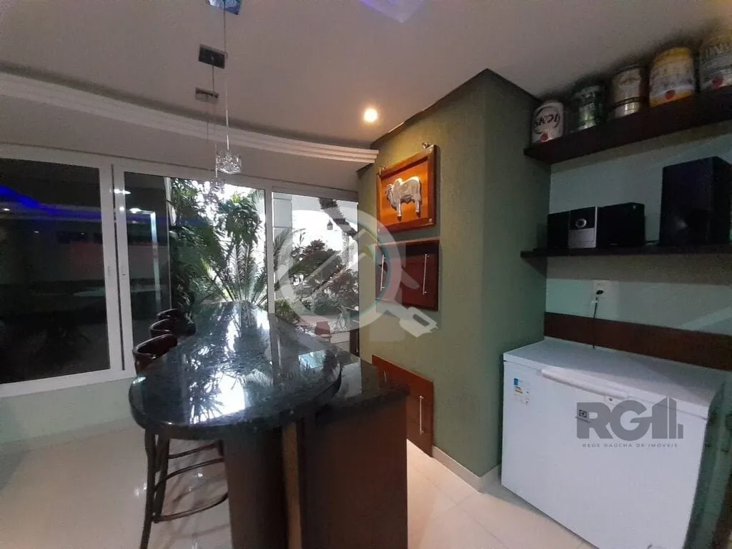 Imagem Apartamento de dois dormitórios sendo um suíte, living dois ambientes com churrasqueira, cozinha e...
