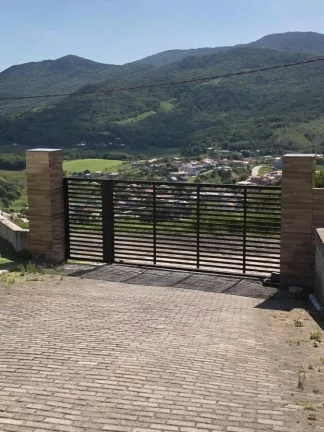 Imagem Imperdível Casa de Alto Padrão com Vista para Mar, Lagoa e Cidade em Garopaba-SC!