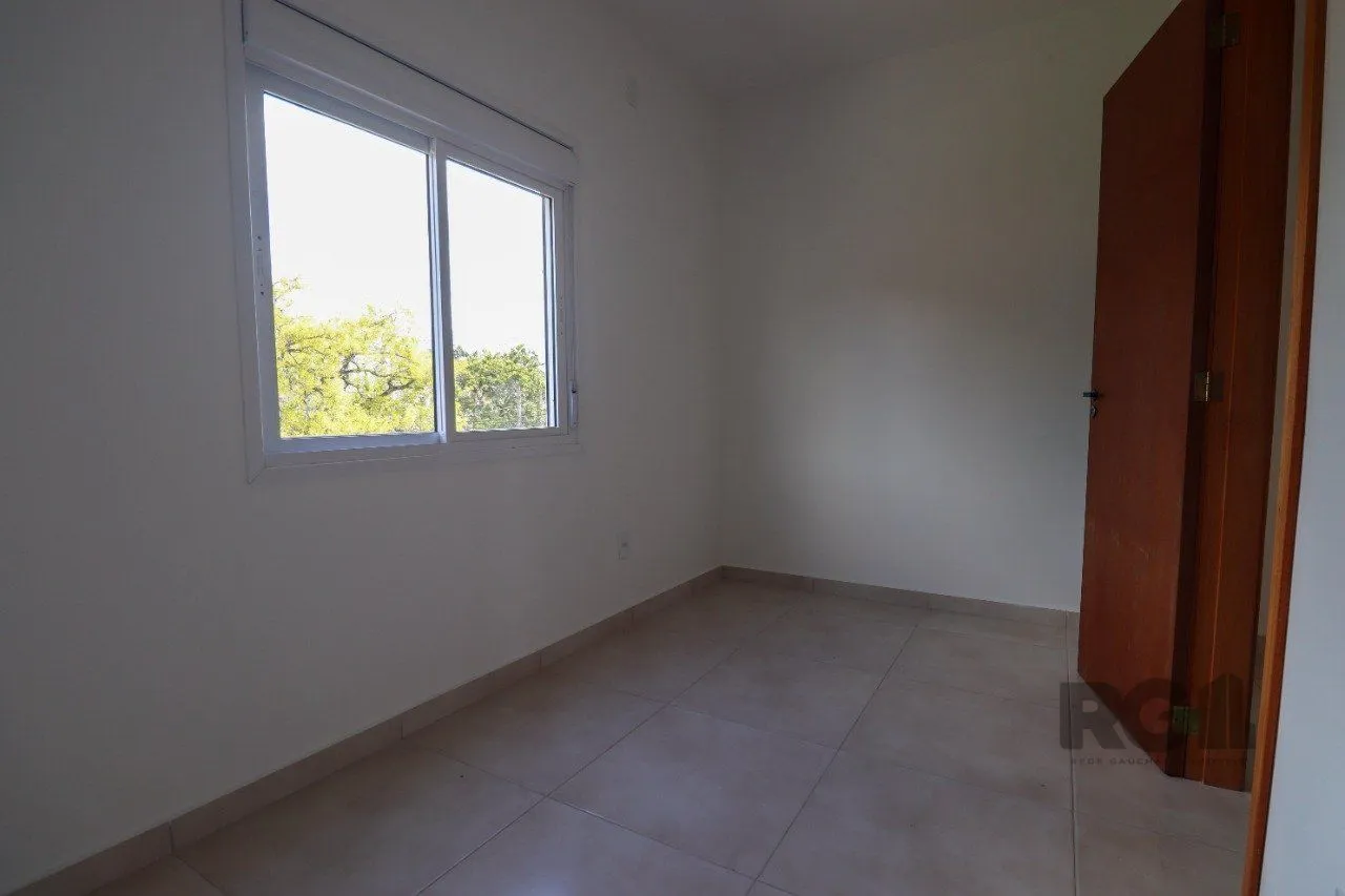 Imagem CASA ESTILO SOBRADO COM 2 QUARTOS E PÁTIO, À VENDA NO BAIRRO VILA NOVA, EM PORTO ALEGRE/RS
