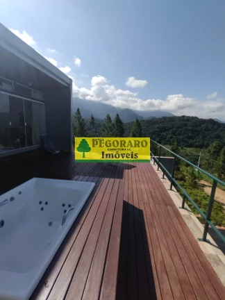 Imagem Casa à venda em Caraguatatuba-SP: 3 quartos, suíte, sala com vista para o mar e deck com hidro!