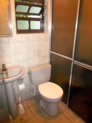 Imagem CASA COM 4 DORMITORIOS (1 SUITES)