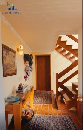 Imagem CASA TÉRREA ESTILO NORMANDO, 4 SUÍTES, TERRENO 1.107m², COND. NA GRANJA