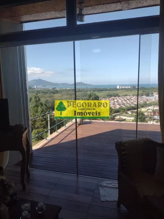 Imagem Casa à venda em Caraguatatuba-SP: 3 quartos, suíte, sala com vista para o mar e deck com hidro!