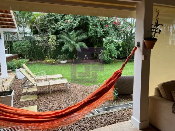 Imagem Casa à Venda no Condomínio Residencial Park Lane – 3 Suítes e Jardim com Árvores Frutíferas