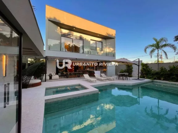 Imagem Casa de alto padrão na Riviera com design refinado e piscina com spa