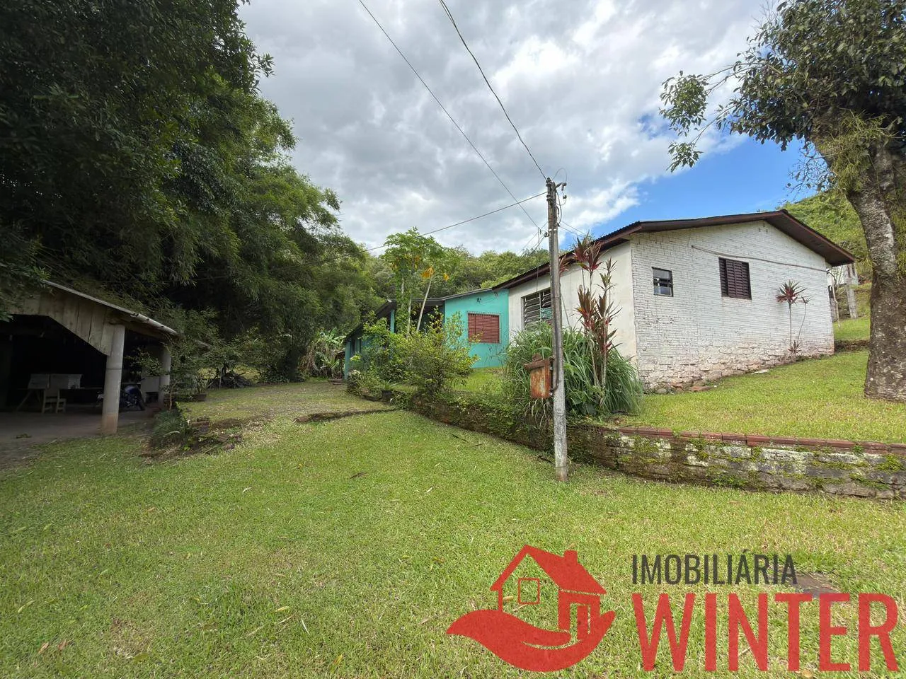 Foto do imóvel Imóvel com 2 casas e um galpão