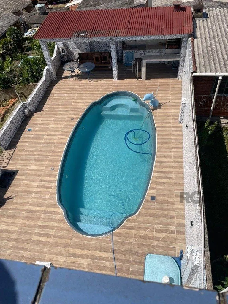 Imagem Casa 420m², 4 dormitórios, 3 vagas no bairro Partenon