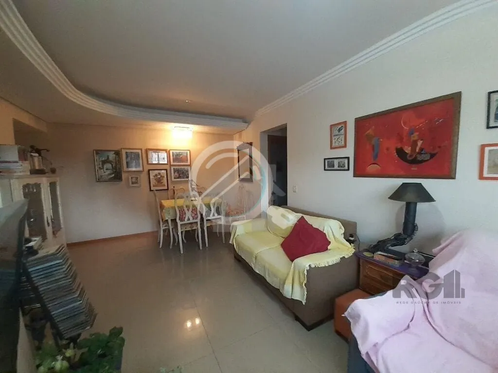 Imagem Apartamento de dois dormitórios sendo um suíte, living dois ambientes com churrasqueira, cozinha e...