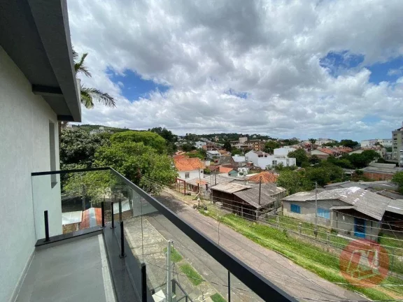 Imagem No bairro Tristeza, casa em condomínio com 2 andares, 3 dormitórios, suíte e 2 vagas.
