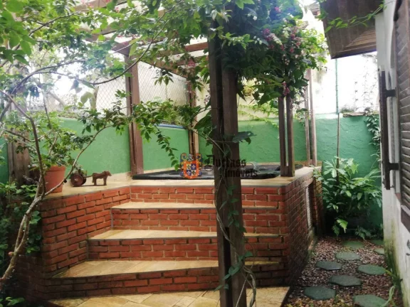 Foto do imóvel Casa com 4 dormitórios à venda, 160 m² por R$ 1.000.000 - Balneário Praia do Pernambuco - Guarujá/SP