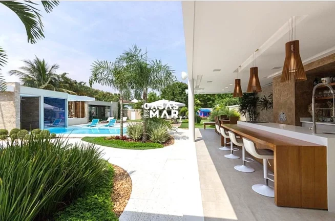Imagem Imponente mansão de luxo na Barra da Tijúca: 5 quartos, 4 suítes, 3 salas, 7 banheiros, 2 vagas de garagem, 920m² de área. Venda!