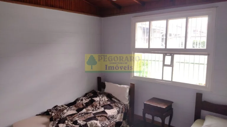 Imagem Imperdível Casa de 4 Quartos na Prainha, Caraguatatuba-SP: 2 Suítes, 2 Salas, 4 Banheiros, 4 Vagas de Garagem!