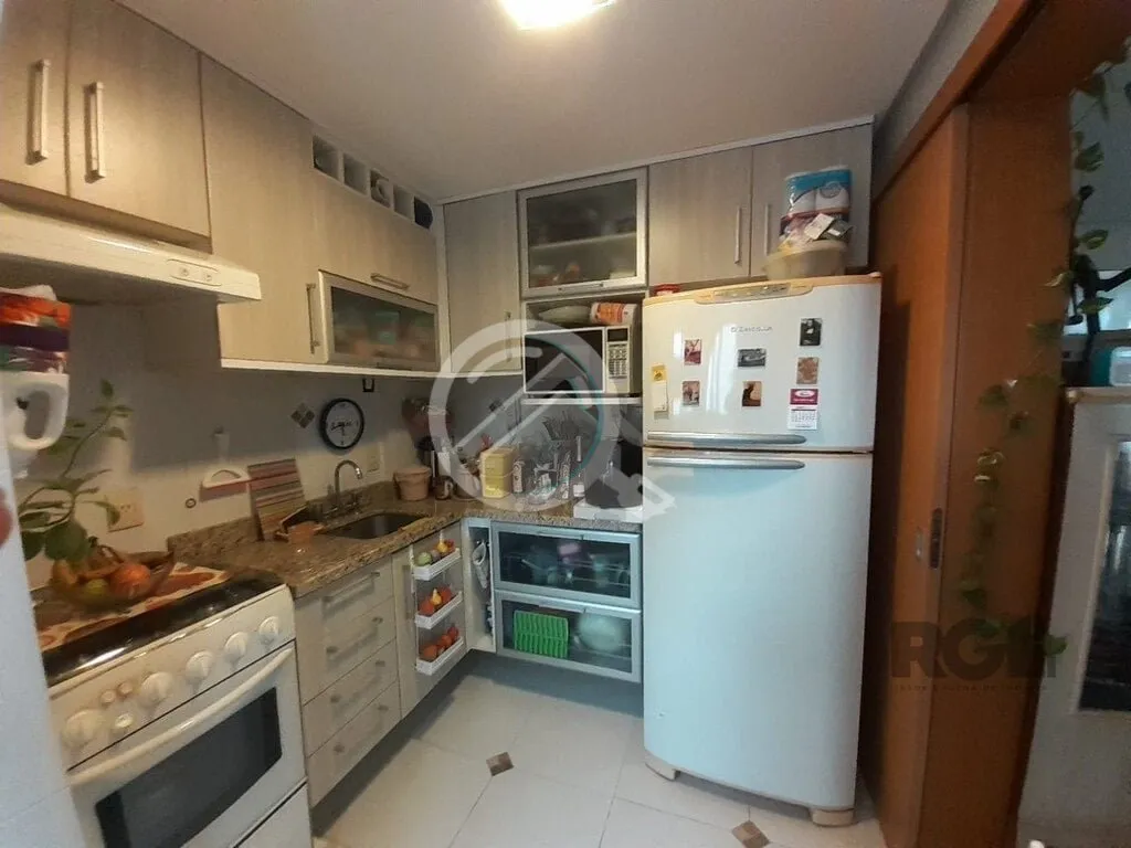 Imagem Apartamento de dois dormitórios sendo um suíte, living dois ambientes com churrasqueira, cozinha e...
