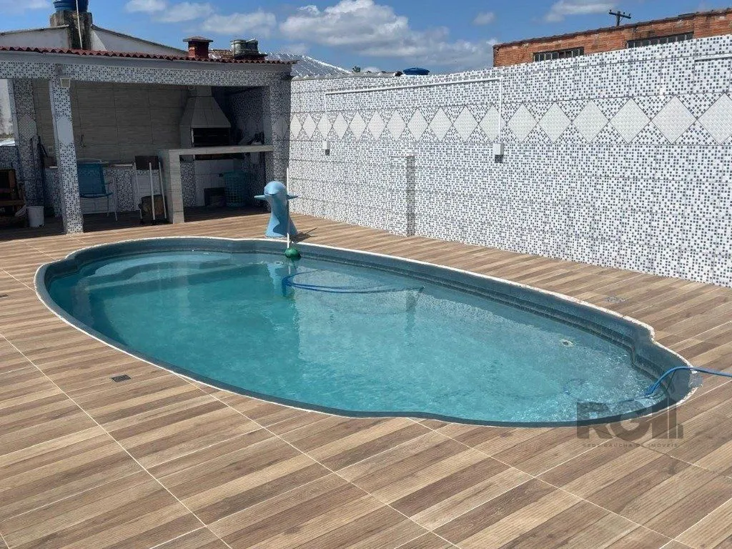 Imagem Casa 420m², 4 dormitórios, 3 vagas no bairro Partenon