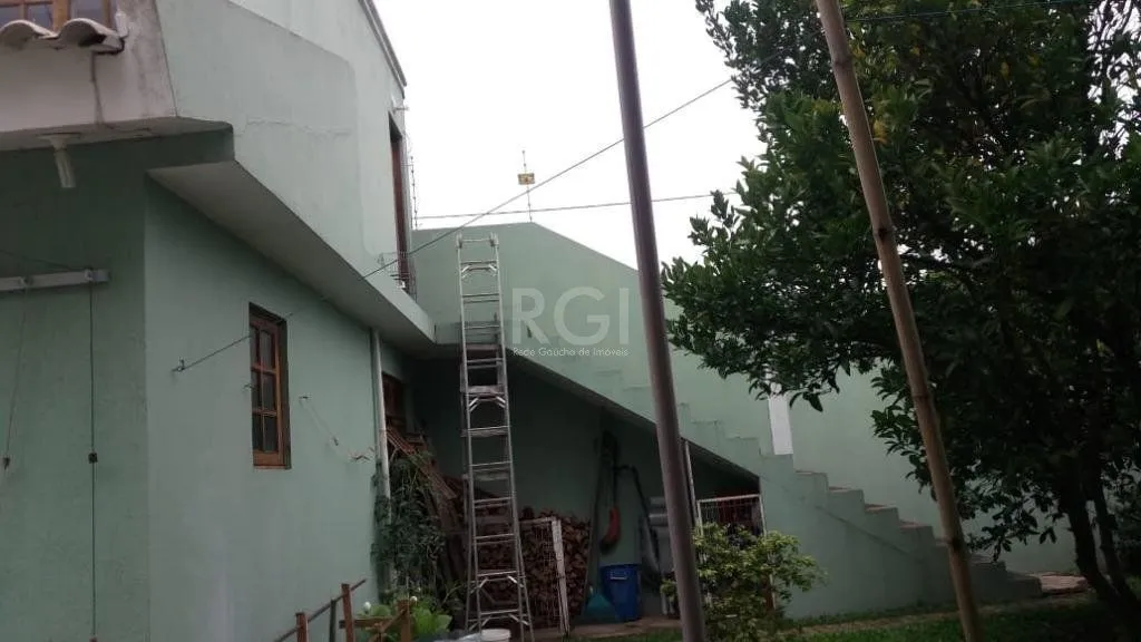 Imagem Casa com 3 dormitórios à venda, 230,11 m² por R$ 900.000,00 - Igara III - Canoas/RS