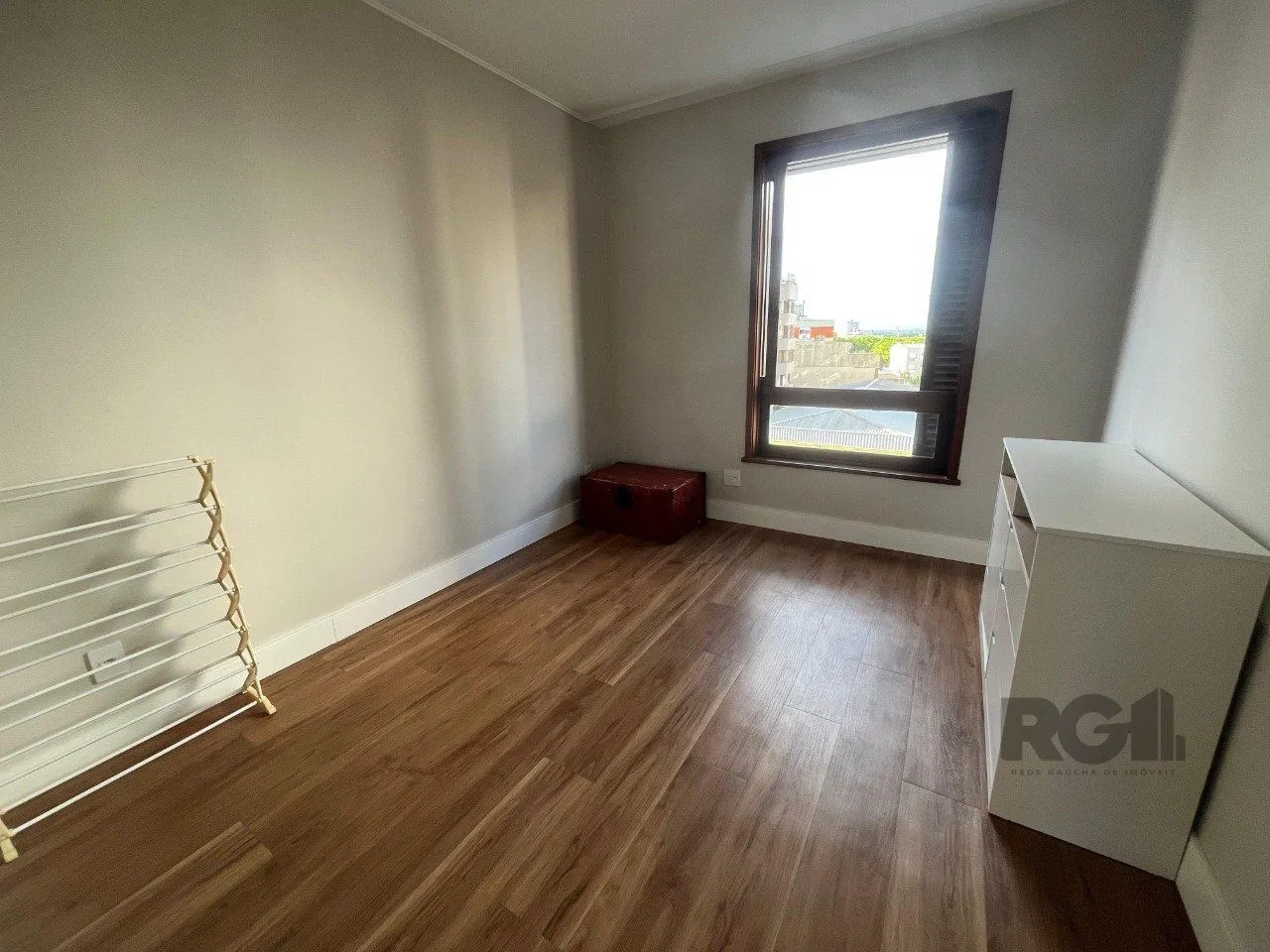Imagem Apartamento de três quartos, suíte e uma vaga de garagem no bairro Independência em Porto Alegre.