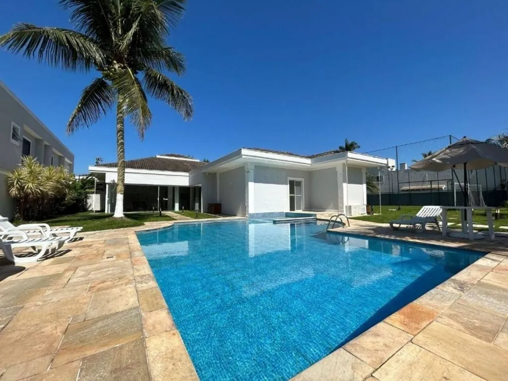 Imagem Alugar casa em condomínio em Jardim Acapulco Guarujá SP, casa á venda em Guarujá SP