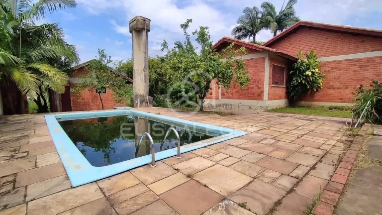 Imagem Sobrado + casa auxiliar em terreno de 1.864m² em Esteio