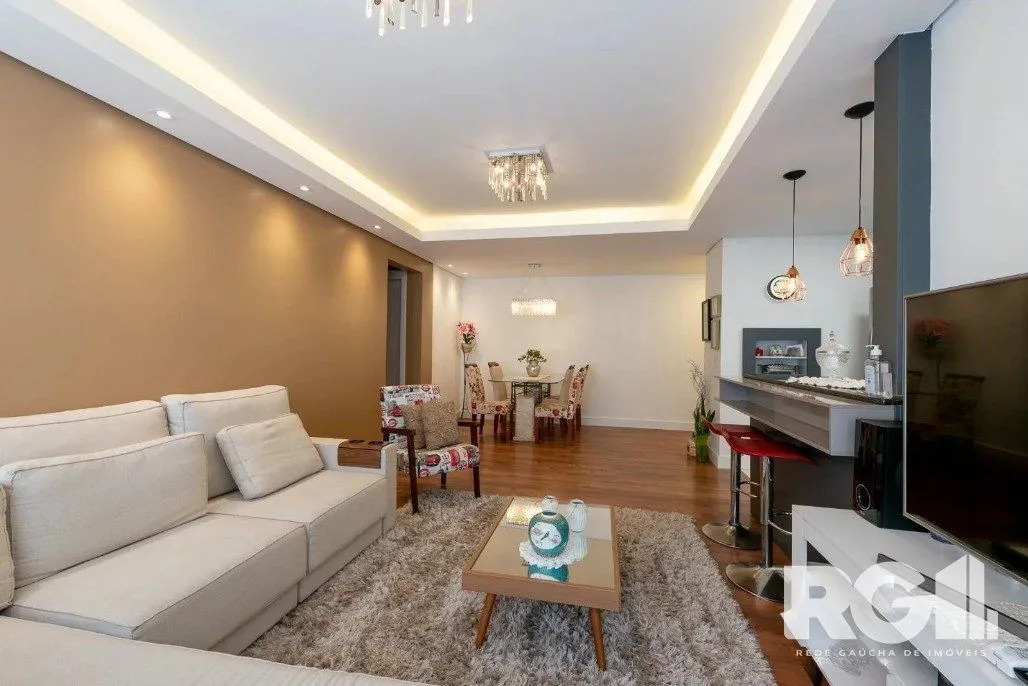 Imagem Apartamento de 3 dormitórios com suíte e churrasqueira, lavabo e 2 vagas de garagem.