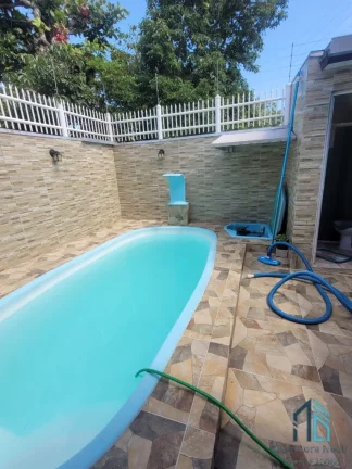 Imagem Sobrado com piscina, área gourmet, 03 quartos com suíte, 70 metros do Mar em Matinhos PR